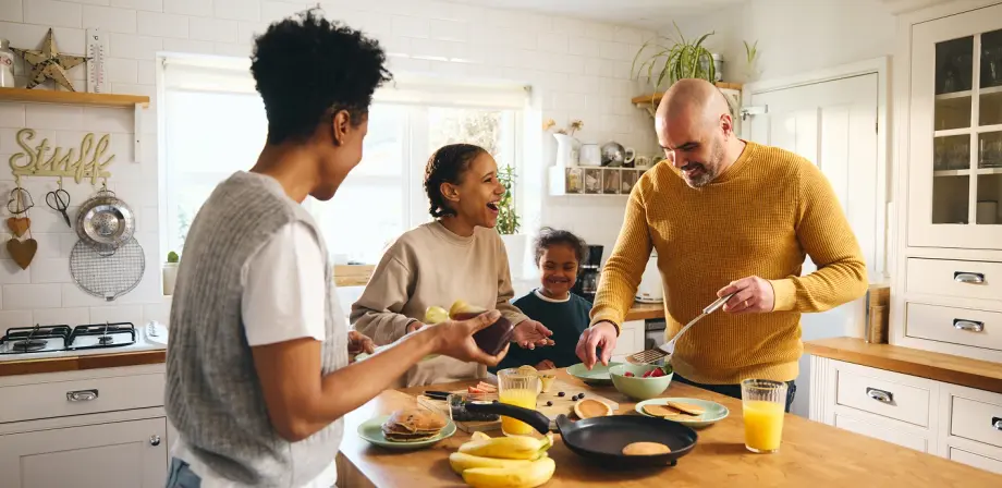 A family enjoying breakfast in a clean kitchen